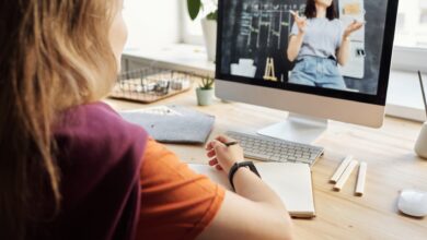 photo of girl watching through imac